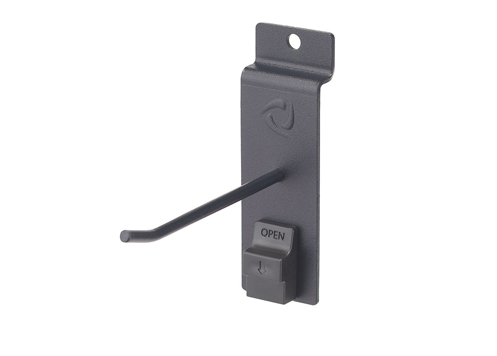 A close-up shot shows a black metal pegboard hook with an attached anti-sweep lock. The lock is a small, dark gray plastic mechanism with "OPEN" and a downward arrow embossed on it, designed to secure items on display.