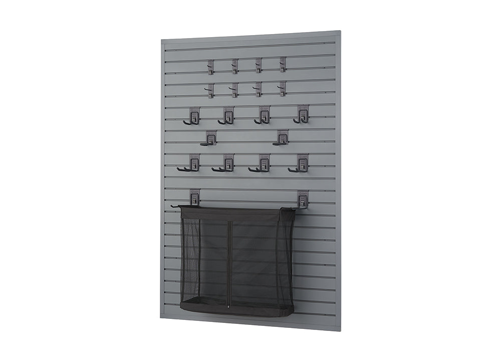 A dark gray slatwall panel is equipped with various hooks and a mesh bag. The hooks are arranged in rows, with smaller single hooks at the top and larger, double-pronged hooks below, while the mesh bag hangs near the bottom.
