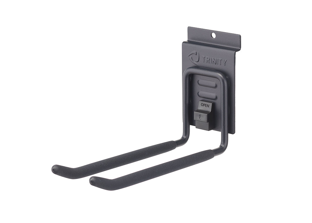 A dark gray metal wall mount hook with two long, U-shaped arms. The arms are covered with black foam padding. The top of the mount has the TRINITY logo and a release latch for easy adjustment.