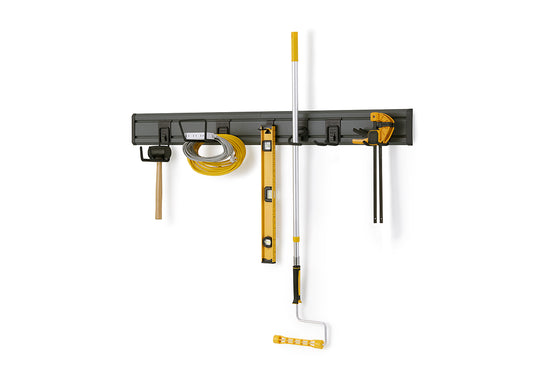 A wall-mounted storage system for tools is shown against a white background. Tools are hung from hooks on the rail, including a mallet, an extension cord, a level, a roller with an extension pole, and a clamp.
