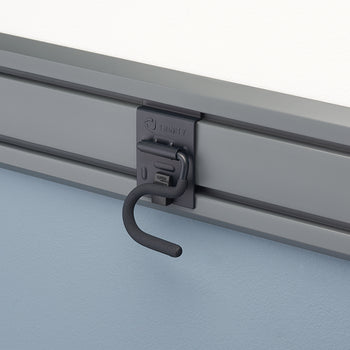 A close-up shot of a gray storage hook, labeled 