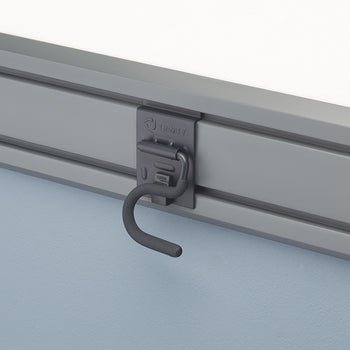 A close-up shot of a gray storage hook, branded 