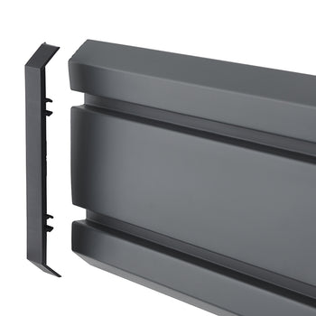 A high-angle product shot shows a matte black, grooved, plastic car running board with a separate end cap. The end cap, which is slightly beveled at the top and bottom, is positioned to the left of the main running board, ready to be attached.