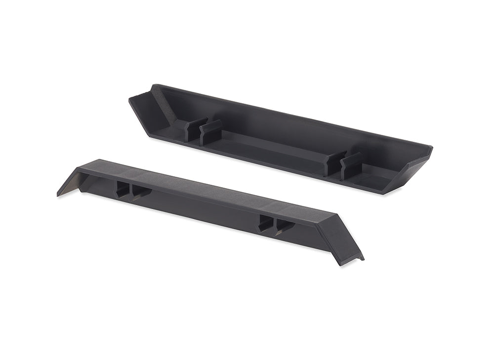 Two long, black plastic pieces are shown against a white background. One piece is a solid bar with two cut-out sections on its underside, while the other is an open, trough-like piece with two raised brackets inside.