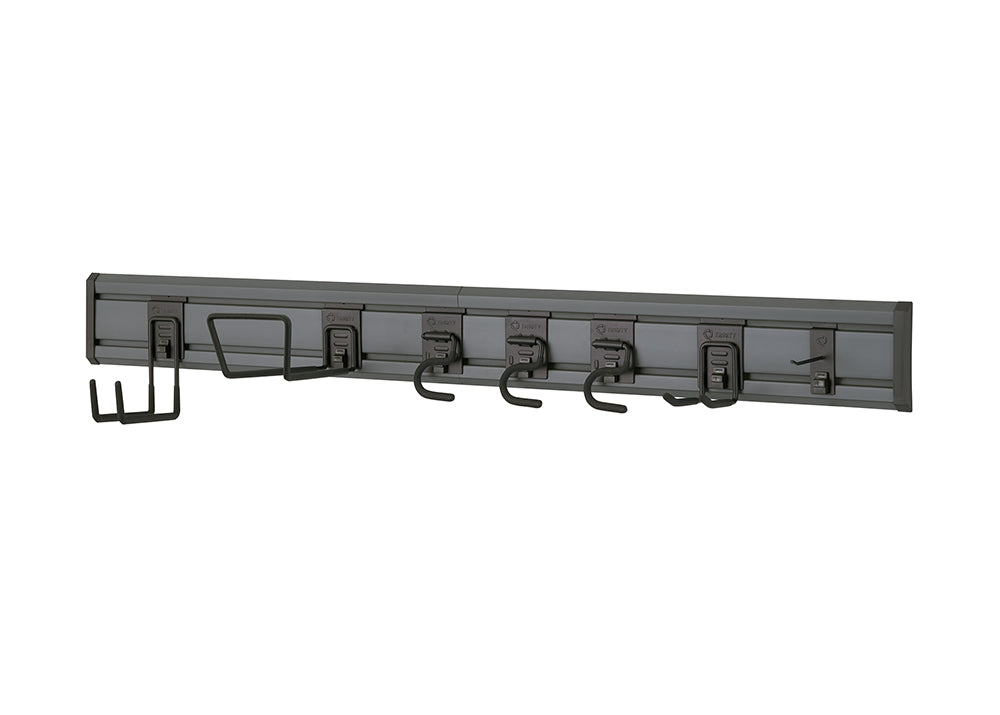 A dark gray, wall-mounted garage or utility storage rack with various hooks and holders attached to it. The hooks include a large U-shaped holder, several smaller hooks of different sizes, and a multi-prong hook on the far right.