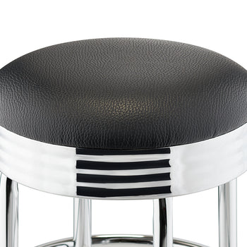 A close-up of a black and chrome bar stool with a retro design. The stool has a round, black, textured seat and a shiny chrome base with three horizontal black stripes.
