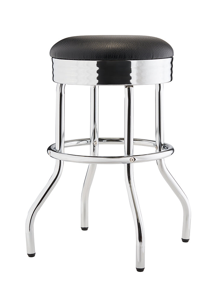 A chrome-legged bar stool with a round, black, upholstered seat. The legs curve outward at the bottom and are connected by a circular footrest.
