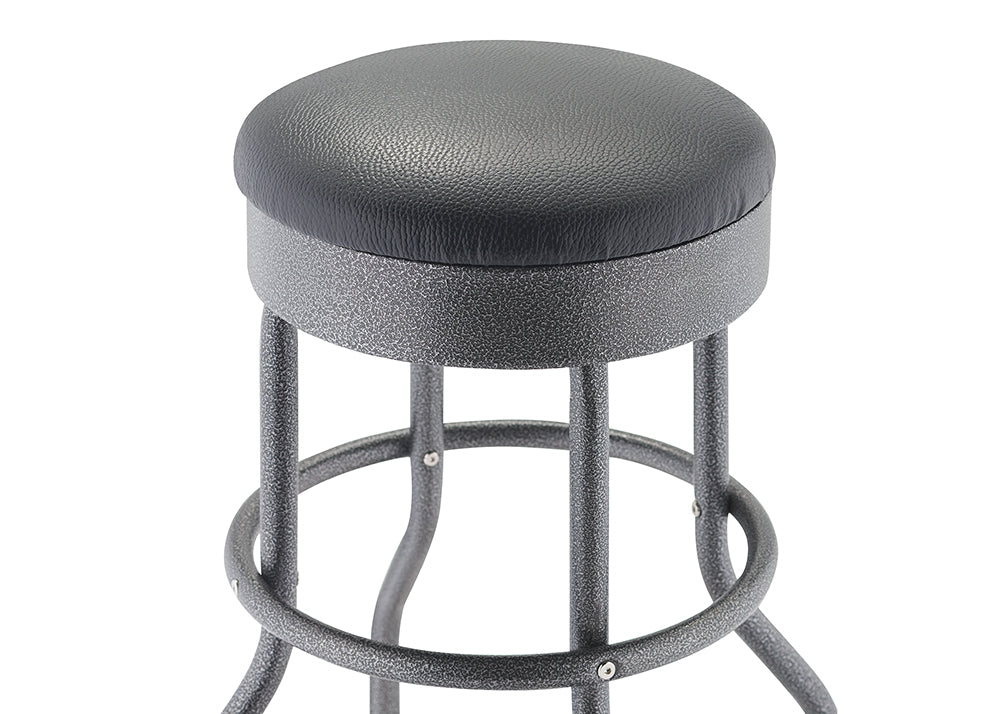 A close-up view of a bar stool with a round, black faux-leather cushioned seat and a textured, metallic black finish on the metal base and legs. The stool's base is made of curved metal tubing and features a circular footrest ring.