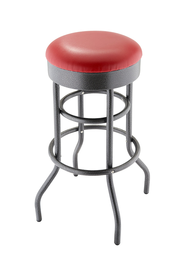 A classic, backless bar stool with a black, textured metal frame and a round, padded red seat. The frame features curved legs and two circular footrests.