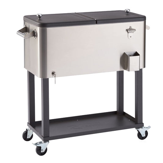 A 100 quart stainless steel cooler with a split black lid sits on a dark gray metal stand with four wheels. The cooler has handles on the sides, a bottle opener, and a bottle cap catcher, and the stand includes a lower shelf.