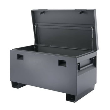 A dark gray, rectangular job site box with an open lid is shown against a white background. The box has handles on the sides and rests on short, sturdy legs.