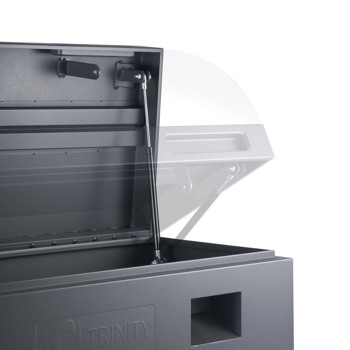 A close-up shows the interior of a gray Trinity job site box with its lid partially open. A gas strut mechanism holds the lid in an elevated position, and the "TRINITY" logo is visible on the lower left.