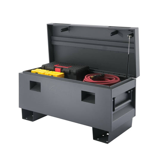 A partially open, dark gray Trinity 36" Job Site Box is shown against a white background. Inside, various tools and equipment are visible, including yellow containers, a black and red toolbox, and a coiled red hose.