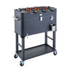 A gray, 80 quart steel foosball cooler with wheels is shown against a white background. The cooler also features a bottle opener and a catch bin on one side.