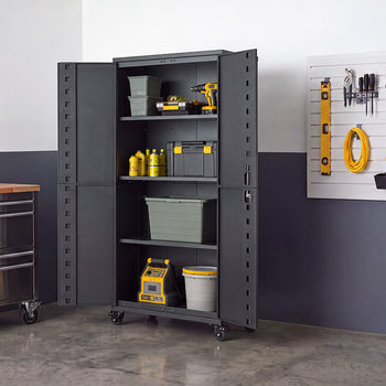An open dark gray steel storage cabinet on wheels is filled with tools, power tool cases, fluids, and storage bins on its multi-tier shelving. Positioned in a garage workshop alongside a stainless steel tool chest and a wall slatboard with hung hand tools, its double doors swing wide open for full access.