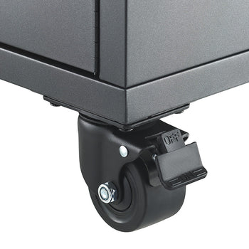 A close-up view focuses on a heavy-duty swivel caster wheel attached to the bottom corner of a dark gray steel storage cabinet. The caster features an integrated step-lock brake pedal labeled "ON" and "OFF" to easily secure the unit in place.