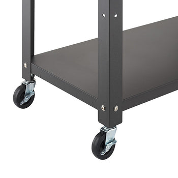 A close-up view highlights the bottom corner of a dark gray metal kitchen cart resting on a white background. The image details the lower open shelf frame secured with silver screws and two black swivel caster wheels with locking mechanisms.