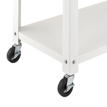 A close-up view highlights the bottom corner of a white kitchen cart set against a plain background. The image details the white metal frame and lower shelf assembled with silver screws, supported by black swivel caster wheels with locking brakes.