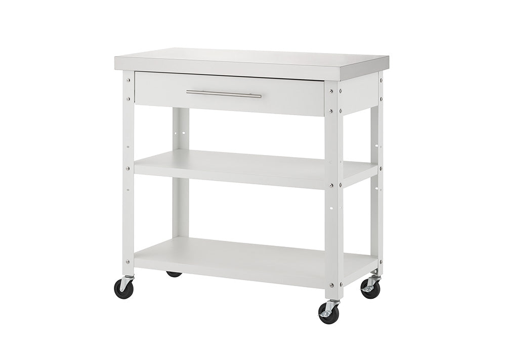 An empty white rolling kitchen cart topped with a stainless steel surface is displayed against a solid white background. It features a top storage drawer with a sleek silver handle, two lower open shelves, and four black caster wheels.