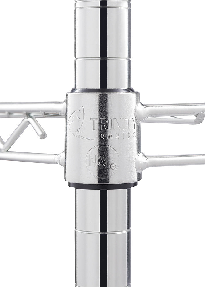 Close-up of a silver metal pole with a connector piece labeled "TRINITY BASICS" and an "NSF" mark. The connector joins wire shelving to the pole, indicating a modular storage system.