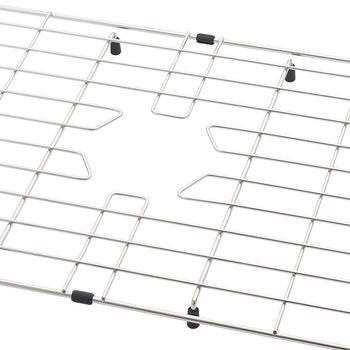 A close-up view of a stainless steel sink protector grid featuring a central cutout for a drain. The metal wire rack is equipped with small black rubber feet and bumpers to protect the sink surface.