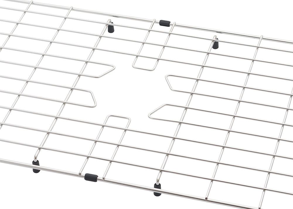 A close-up view of a stainless steel sink protector grid featuring a central cutout for a drain. The metal wire rack is equipped with small black rubber feet and bumpers to protect the sink surface.