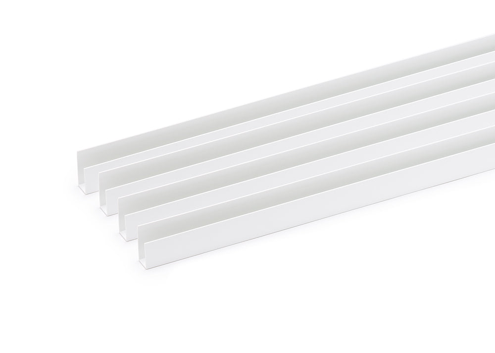 Four identical, edge trim arranged diagonally from the lower left to the upper right against a stark white background. The channels are nested closely together, creating a repetitive pattern of parallel lines and shadows. 