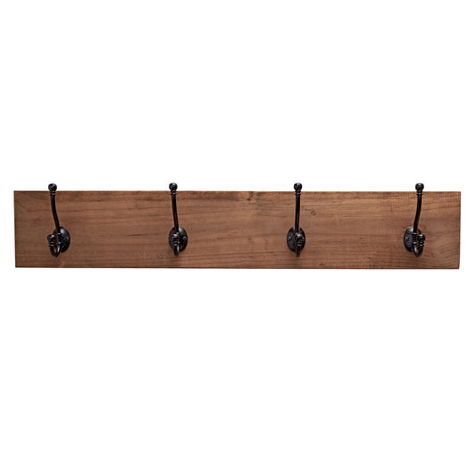 A wooden wall-mounted coat rack with four black metal hooks evenly spaced along its length. The wood has a natural walnut finish, and the hooks have a vintage-style design.