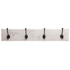 A wall-mounted coat and towel rack featuring four black metal hooks attached to a whitewashed wooden plank. The rustic design includes visible wood grain and knots, giving it a vintage farmhouse aesthetic.
